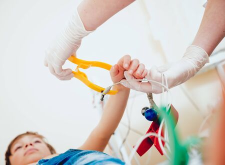 Doctor with electrocardiogram equipment making cardiogram testの写真素材
