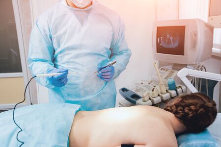 Surgeon and assistant in operating room with surgery equipment. Backgroundの写真素材