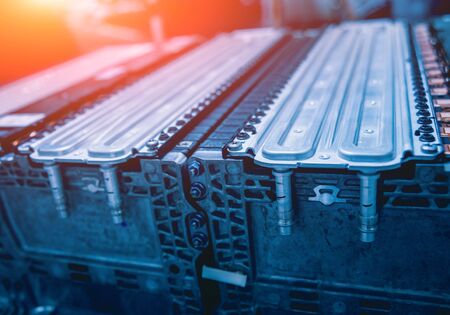 Charging the batteries of the elecric motor. Disassembling the battery of an electric vehicle engine. Car serviceの写真素材