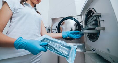 Sterilizing medical instruments in autoclave. Dental officeの写真素材