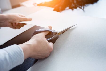 Pattern making process. Fabric industry production line. Textile factory. Working tailoring process cloth.の写真素材