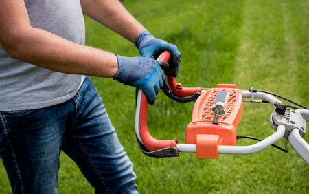Gardener mowing the lawn. Landscape design. Gardening