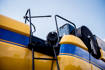 Modern agricultural machinery and equipment. Yellow agricultural harvester. Combine.