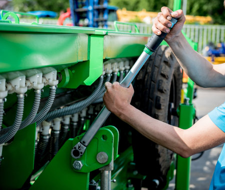 The mechanics repair combine harvester. Modern agricultural machinery and equipment. Industrial...