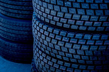 Stack of wheels on dark background. Industrial details. Agricultural exhibitionの写真素材