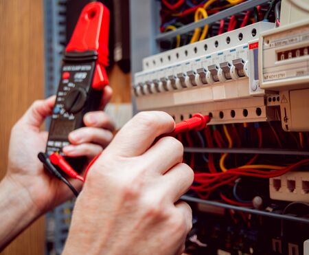 Electrical equipment. Tester in the hands. Background and textureの写真素材