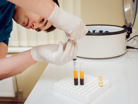 Platelet-Rich plasma preparation. Plasma in syringe. Centrifuge. Background