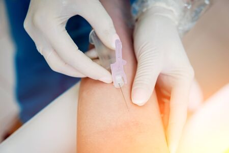 Closeup of nurse's hands taking a blood sample. Backgroundの写真素材