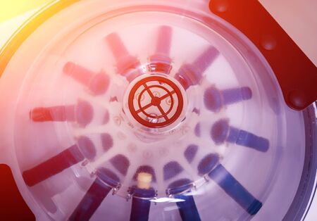 Platelet-Rich plasma preparation. Tube with blood in hands. Centrifuge.の写真素材