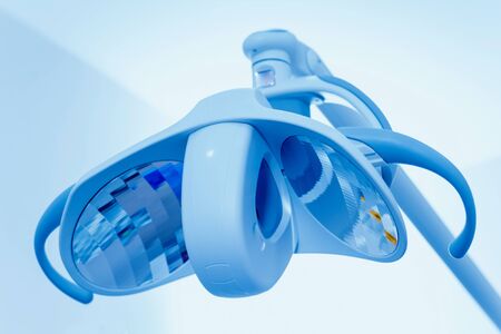 Preparation for dental surgery, fixing sterile handles to the luminaireの写真素材