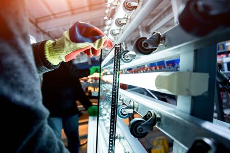 Conveyor belt for production a window pane. Industrial equipment. Backgroundの写真素材