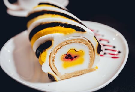 Dessert with cream on the wihte plateの写真素材