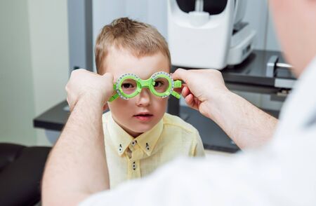 Trial frame. Glasses prescription for a child. Childs hypermetropy.の写真素材