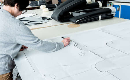 Fabric industry production line. Textile factory. Working tailoring process cloth. Modern equipmentの写真素材