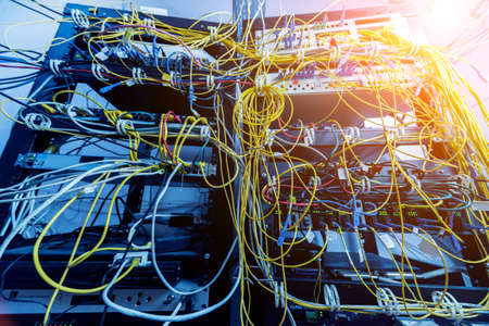 Server room with computers for internet. Network cables connected to switches.の写真素材