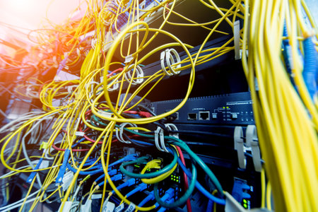 Server room with computers for internet. Network cables connected to switches.