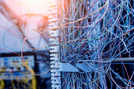 Server room. Telephone cables connected to switches.の写真素材