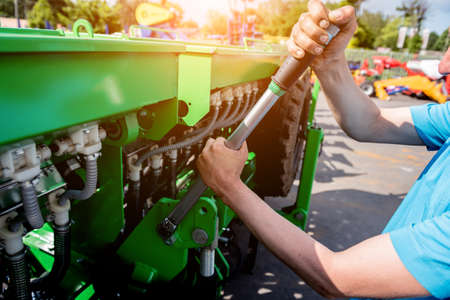 The mechanics repair combine harvester. Modern agricultural machineryの写真素材