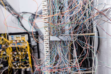 Server room. Telephone cables connected to switches.の写真素材