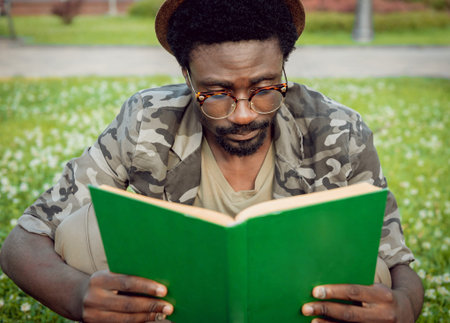 African student in the park. Beautiful background