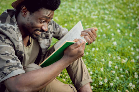 African student in the park. Beautiful backgroundの写真素材