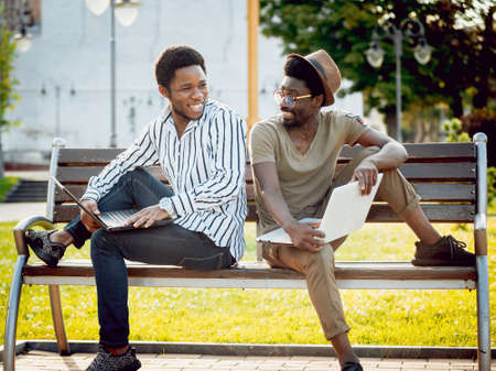 African students in the park. Beautiful backgroundの写真素材