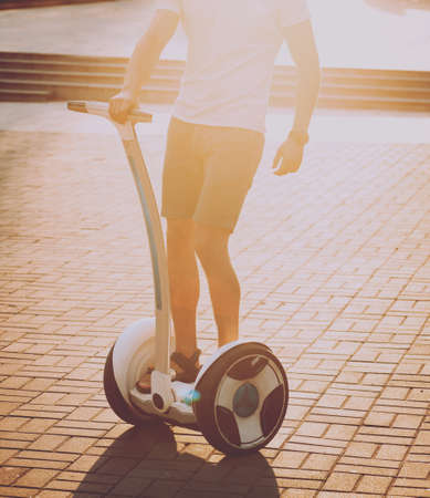 Young couple driving on monowheel in the parkの写真素材