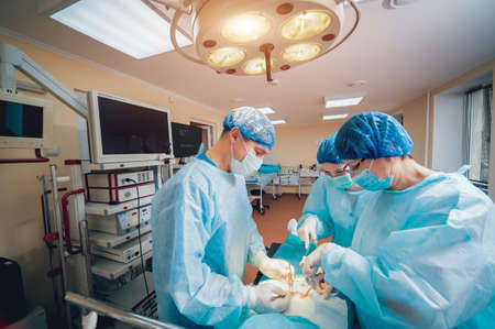 Group of surgeons in operating room with surgery equipment. Backgroundの写真素材