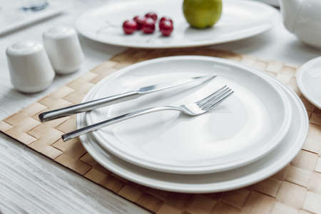 Beautiful decorated table at restaurant. Light background. の写真素材
