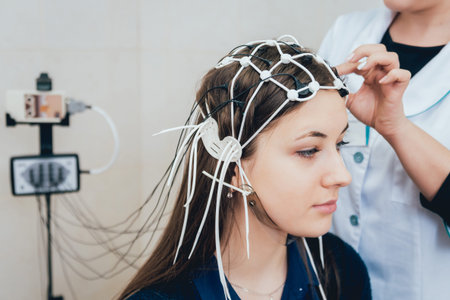 Doctor and patient with encephalography electrode. Electroencephalogram