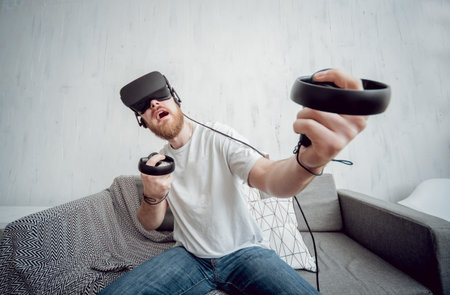 The young man playing games with virtual reality goggles. VR technologies