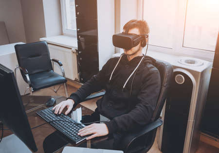 The young man wearing virtual reality gogglesの写真素材