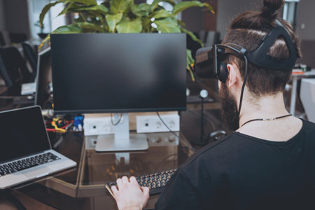 The young man wearing virtual reality goggles