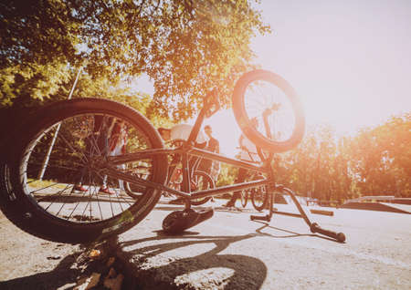 Bmx bicycles lays on the ground in the skatepark. Bicycle repairの写真素材