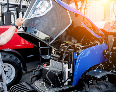 Modern new agricultural tractor engine. Machinery and equipment. Industrial details.