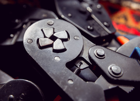 Electrical equipment. Electricity cable and crimper. Background and texture