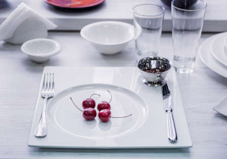 Beautiful decorated table at restaurant. Light backgroundの写真素材
