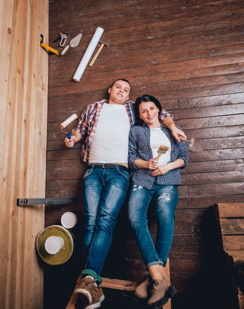 Happy couple making repairs to their home.の写真素材