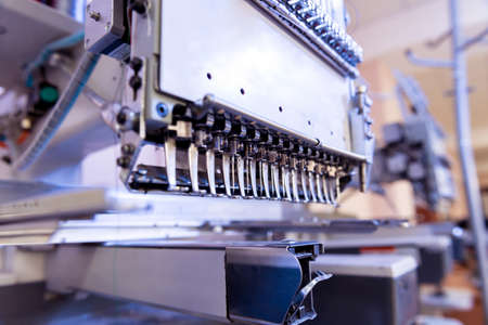 Fabric industry production line. Textile factory. Working tailoring processの写真素材