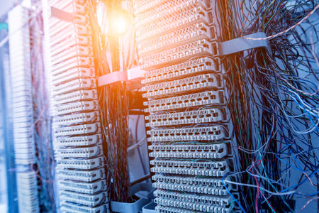Server room. Telephone cables connected to switches.