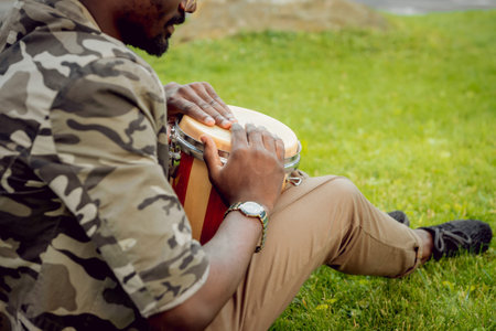 African student in the park. Beautiful background