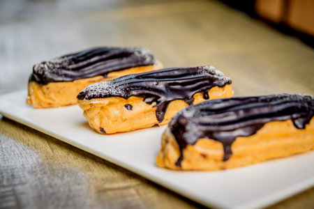 Dessert with custard and chocolate watered. Bakery.