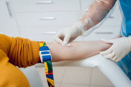 Closeup of nurses hands taking a blood sample