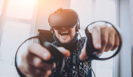 The young man plays a game at the office.の写真素材