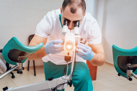 Gynecologist working with colposcope in clinic. Medical
