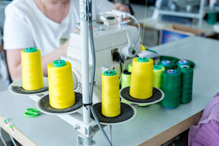 Fabric industry production line. Textile factory. Working tailoring processの写真素材