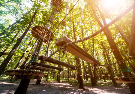 Rope park in a forest. Adventure summer park.の写真素材