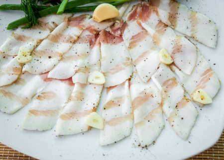 Bacon with vegetables on a white plate. Restaurant.の写真素材