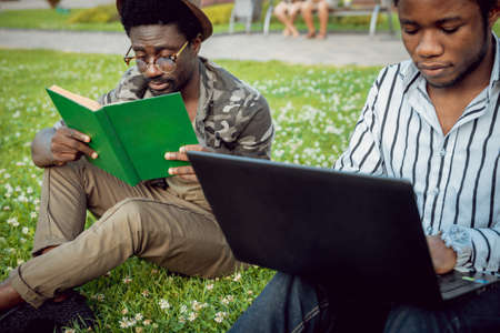 African students in the park. Beautiful backgroundの写真素材
