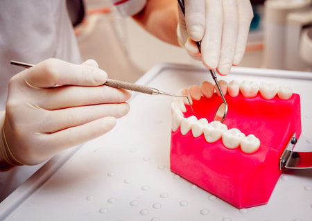 Dentures and medical equipment. Dental office. Light medical background.
